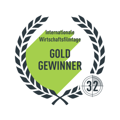 Logo mit Lorbeerkranz und dem Schriftzug "Internationale Wirtschaftsfilmtage Gold Gewinner"